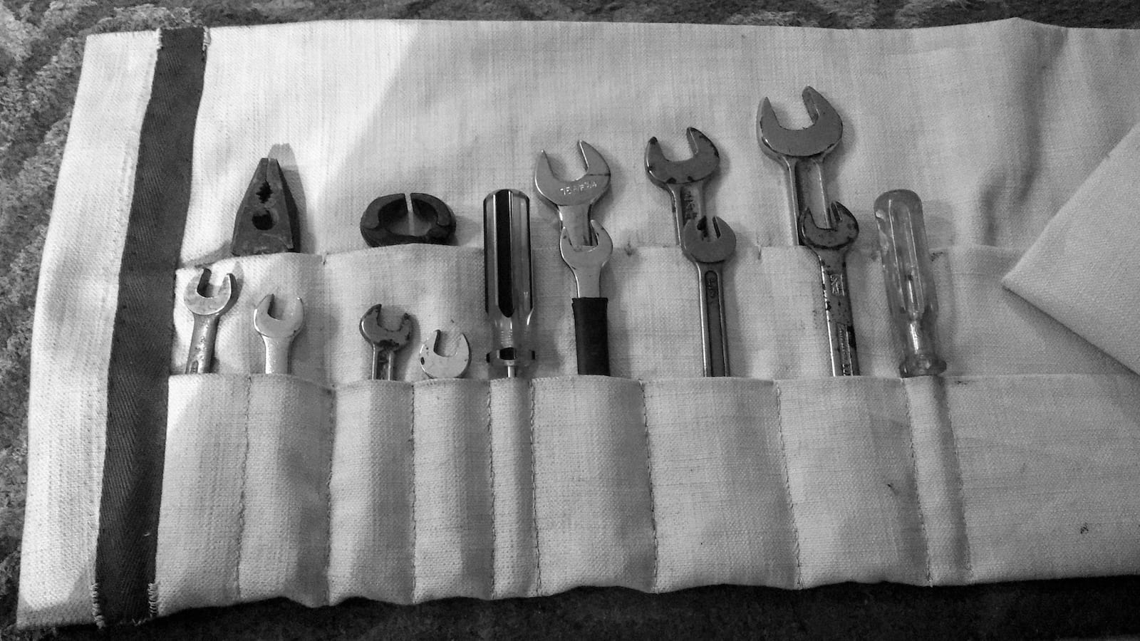 Picture of spanners and other tools in a tool roll - illustrating a blog post on website content audit